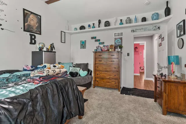 a view of living room and workspace