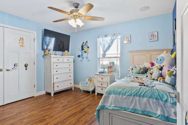 a view of room with wooden floor