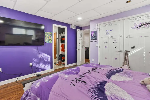 a bathroom with a sink vanity mirror and toilet
