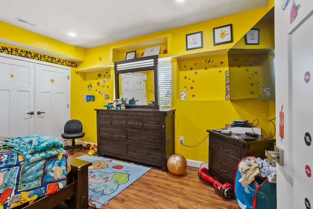 a bed room with a bed and toys