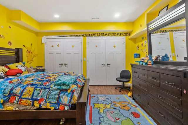 a kitchen that has a lot of stainless steel appliances and cabinets