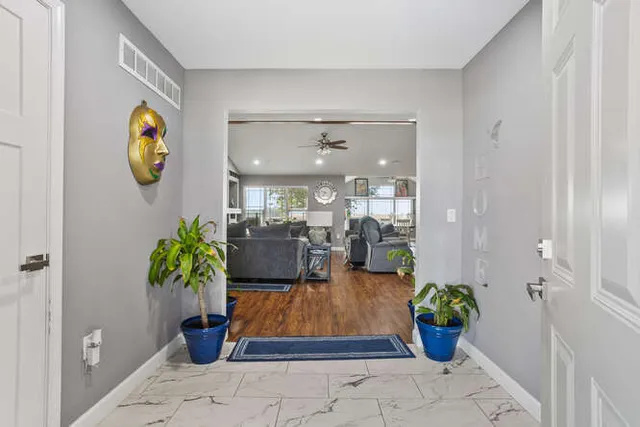 a lobby with furniture and potted plant