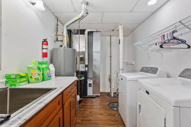a backyard of a house with table and chairs