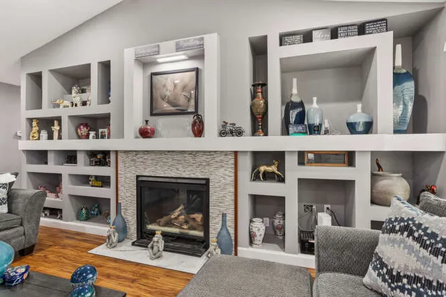 a living room with furniture and a fireplace