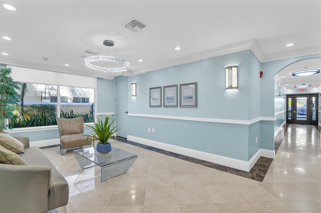 9 Northeast 20th Avenue, Unit 403 Deerfield Beach, FL 33441 - Photo 41 of 58 a living room with furniture and a potted plant