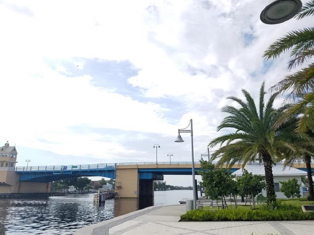 9 Northeast 20th Avenue, Unit 403 Deerfield Beach, FL 33441 - Photo 52 of 58 a view of a terrace with a garden