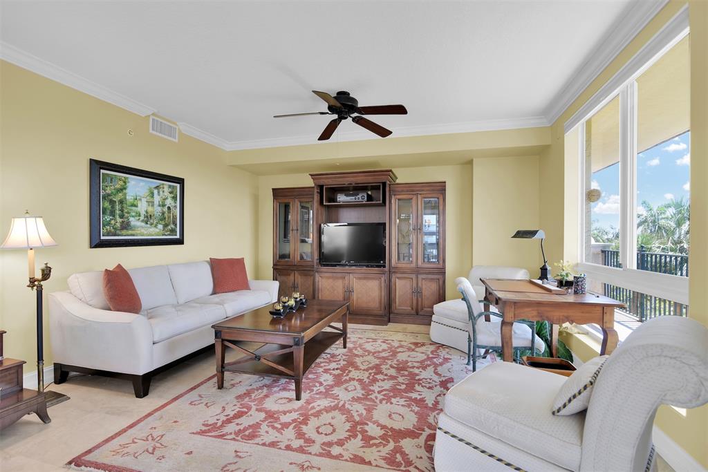 9 Northeast 20th Avenue, Unit 403 Deerfield Beach, FL 33441 - Photo 6 of 58 a living room with furniture and a large window
