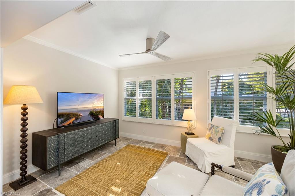 308 2nd Street South, Unit 308 Naples, FL 34102 - Photo 20 of 36 Sunny Sitting Room off of the Primary Bedroom