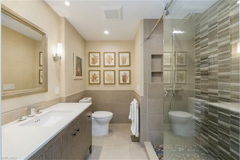308 2nd Street South, Unit 308 Naples, FL 34102 - Photo 21 of 36 Primary Bathroom, updated, frameless shower
