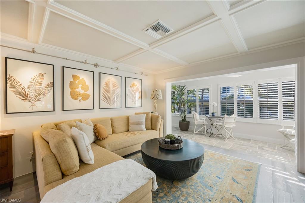 308 2nd Street South, Unit 308 Naples, FL 34102 - Photo 6 of 36 Light, bright family room is open to the sun room
