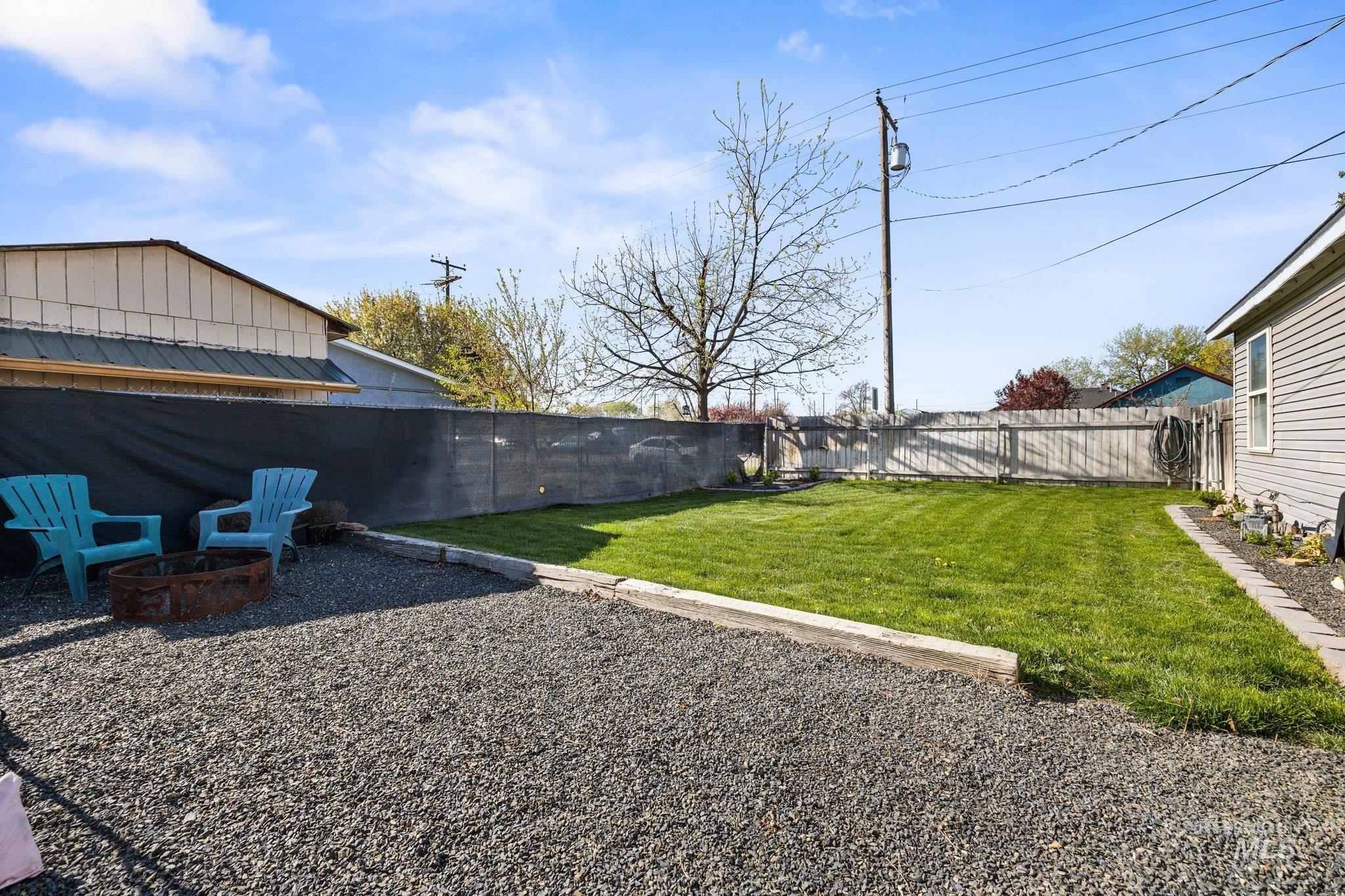1504 2nd Street North Nampa, ID 83687 - Photo 26 of 29 Fenced backyard with an outdoor fire pit