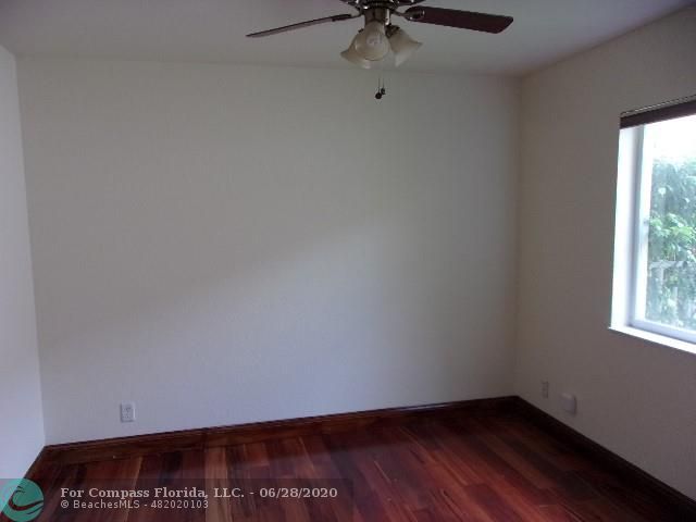 1564 Sunset Way Weston, FL 33327 - Photo 18 of 40 an empty room with a window