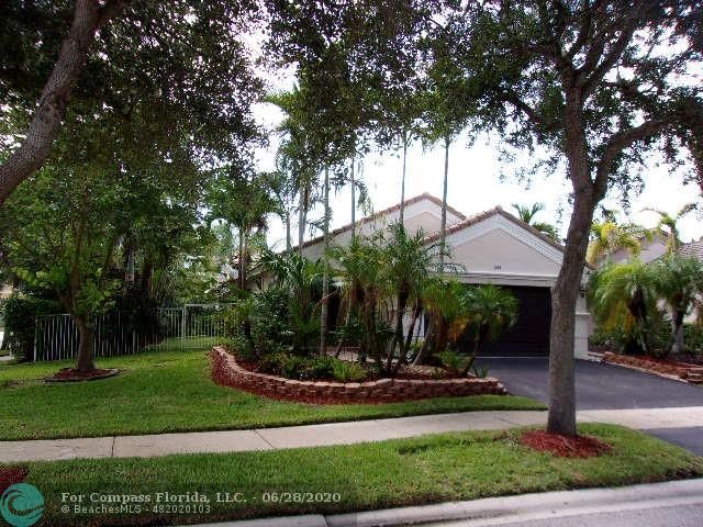 1564 Sunset Way Weston, FL 33327 - Photo 37 of 40 a view of a house with a yard and tree s