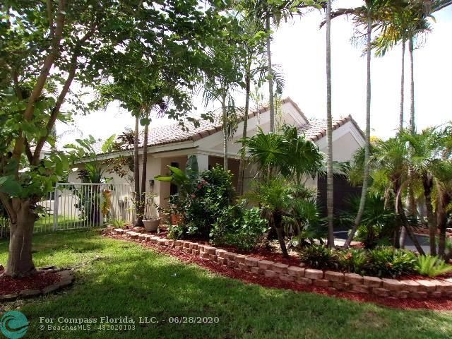 1564 Sunset Way Weston, FL 33327 - Photo 39 of 40 a view of a house with a tree in a yard