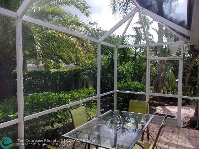 1564 Sunset Way Weston, FL 33327 - Photo 4 of 40 a view of a chair and tables in the balcony