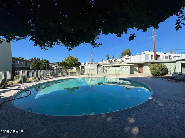 a view of a swimming pool with a house