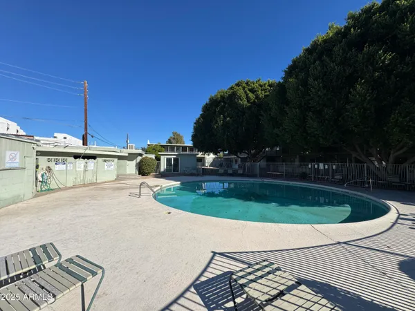 a view of a swimming pool with a patio