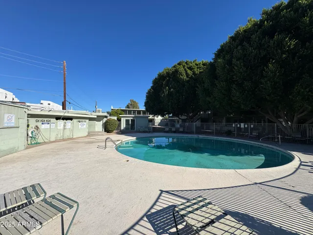 a view of a swimming pool with a patio