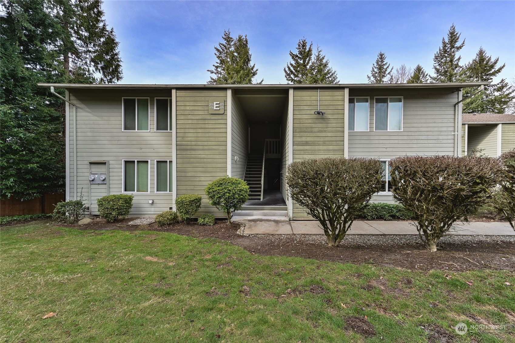 14401 Southeast Petrovitsky Road, Unit E105 Renton, WA 98058 - Photo 1 of 38 a front view of a house with garden