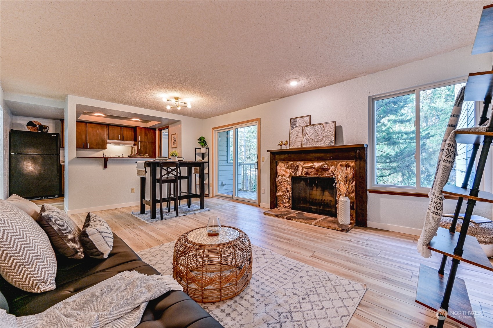 14401 Southeast Petrovitsky Road, Unit E105 Renton, WA 98058 - Photo 11 of 38 a living room with furniture and a fireplace