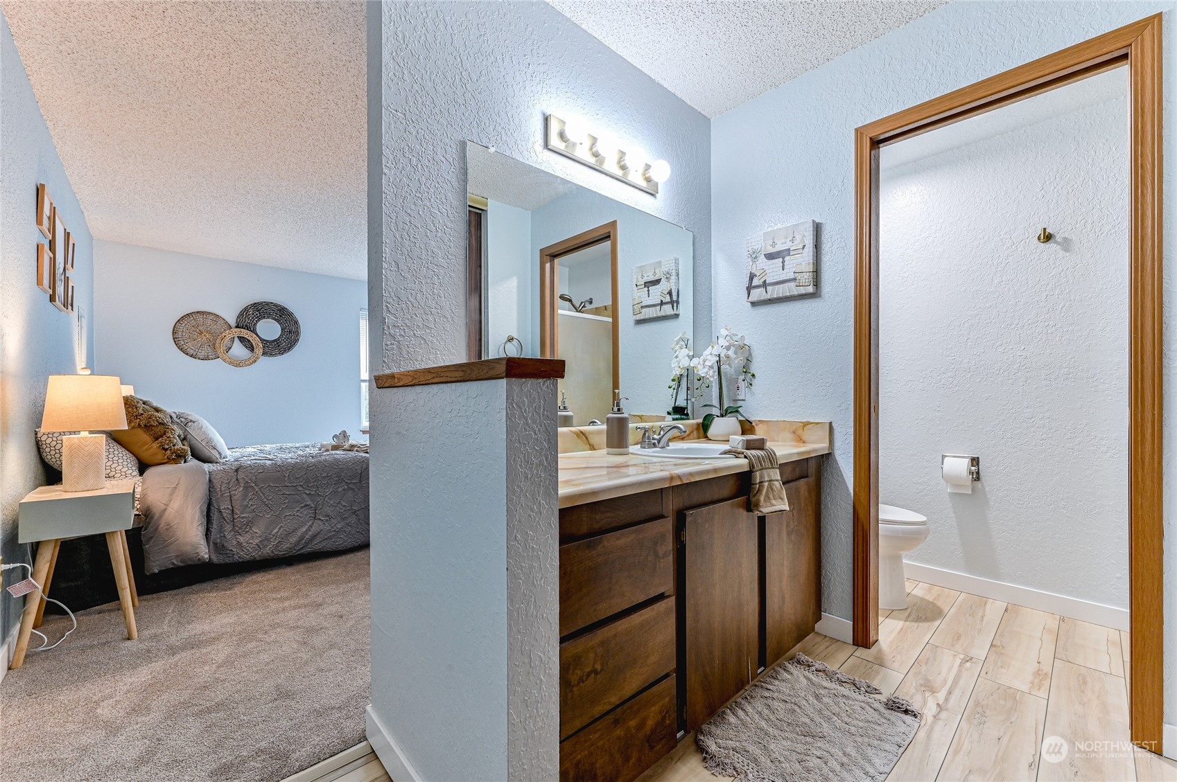 14401 Southeast Petrovitsky Road, Unit E105 Renton, WA 98058 - Photo 20 of 38 a living room with furniture and a mirror