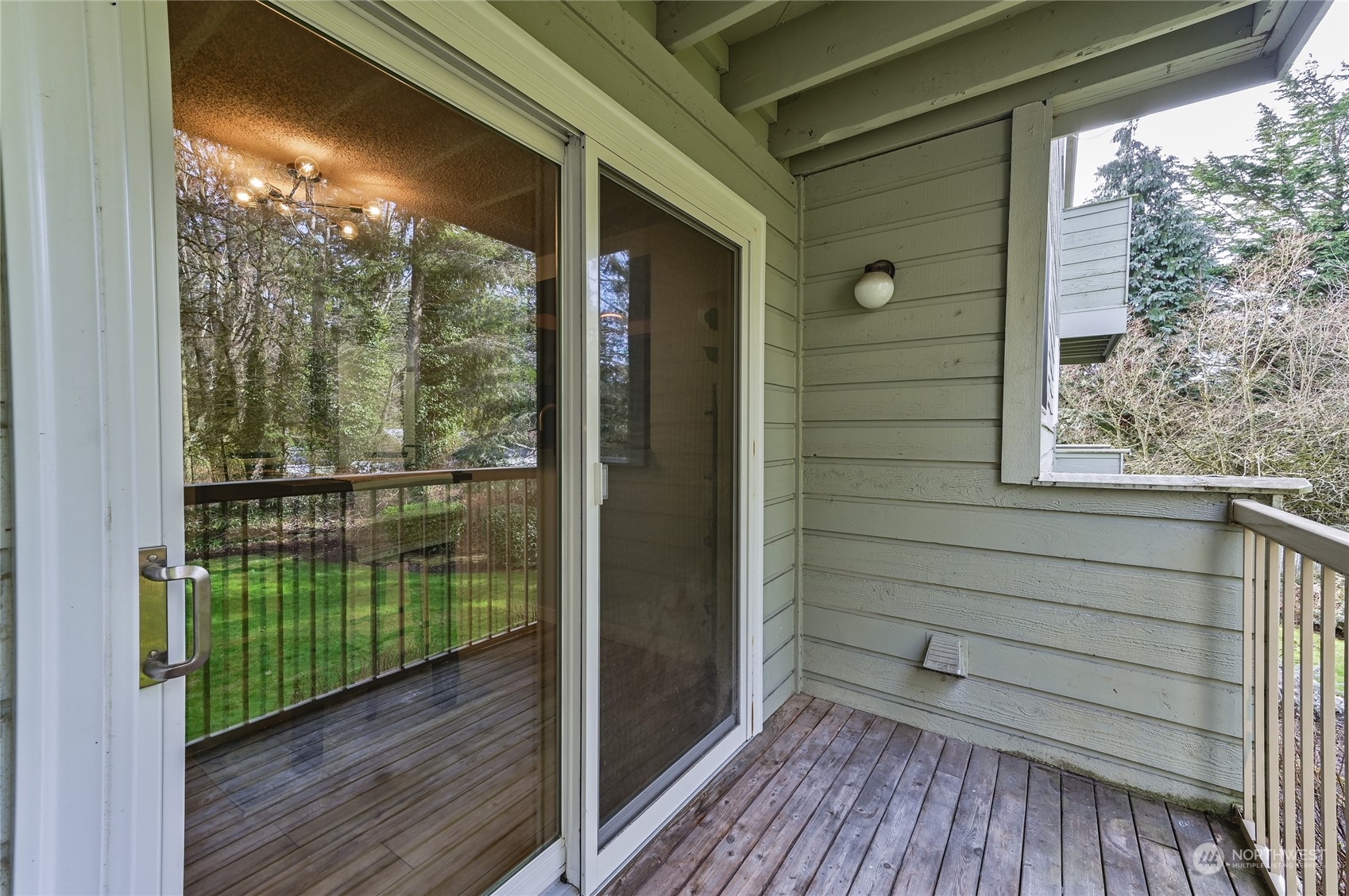 14401 Southeast Petrovitsky Road, Unit E105 Renton, WA 98058 - Photo 28 of 38 a view of a balcony with wooden floor