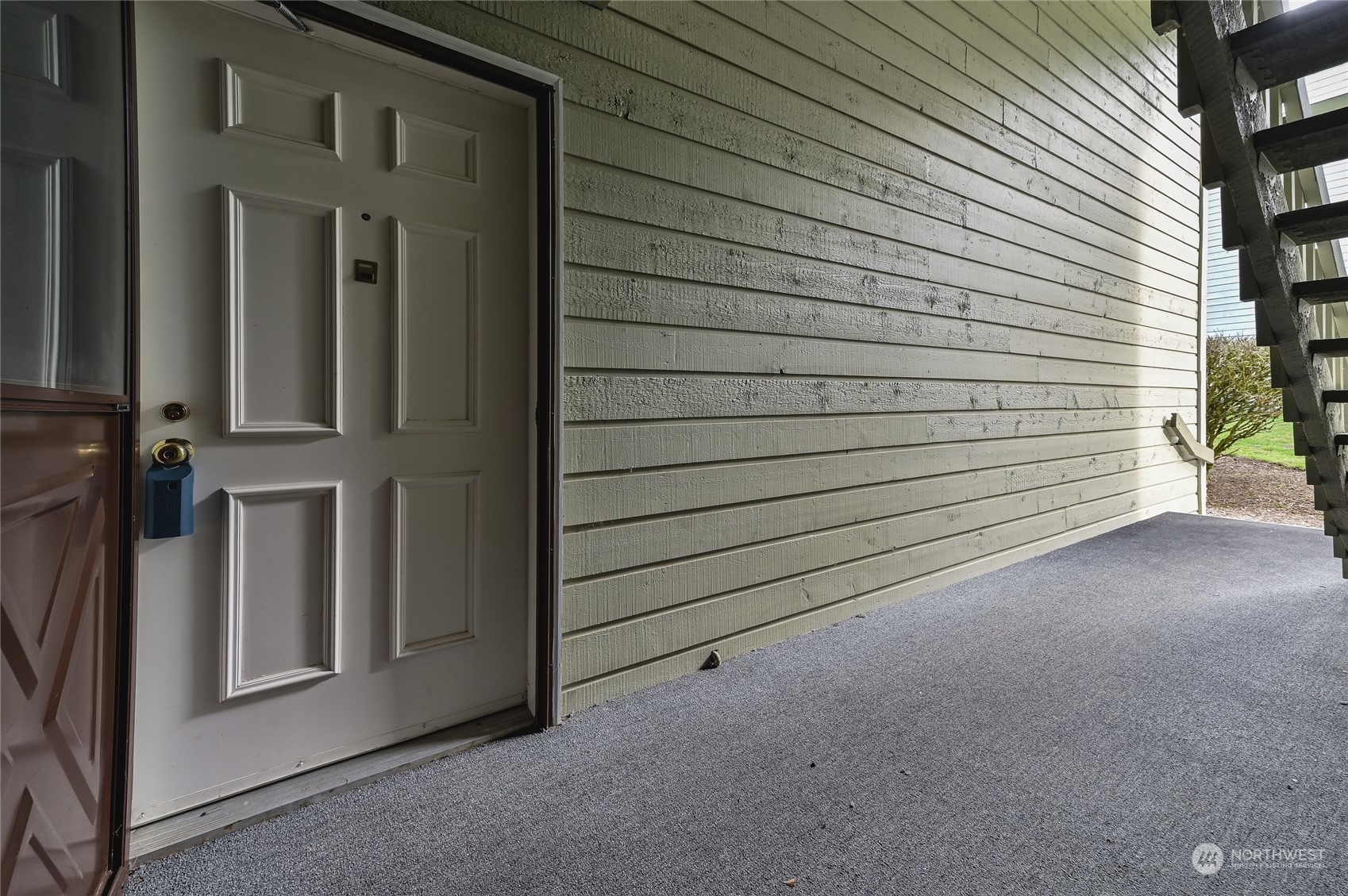 14401 Southeast Petrovitsky Road, Unit E105 Renton, WA 98058 - Photo 31 of 38 a view of a house with a garage