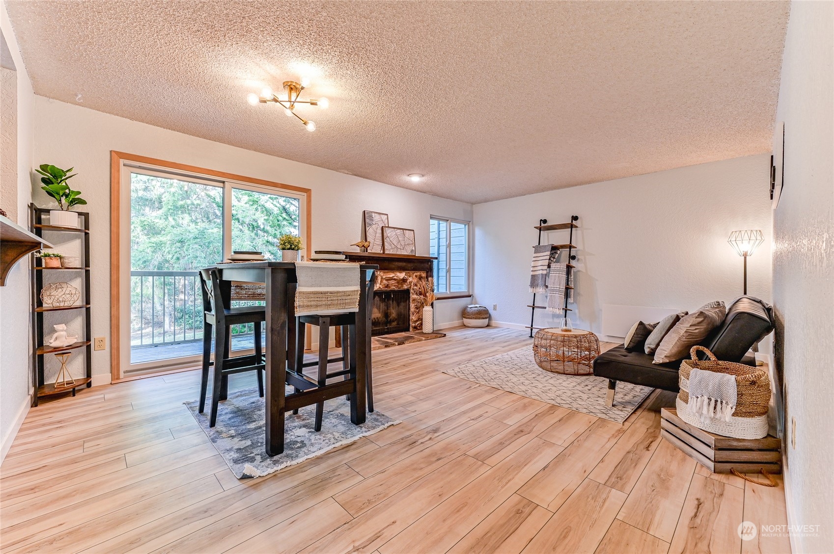 14401 Southeast Petrovitsky Road, Unit E105 Renton, WA 98058 - Photo 9 of 38 a view of a dining room with furniture window and wooden floor