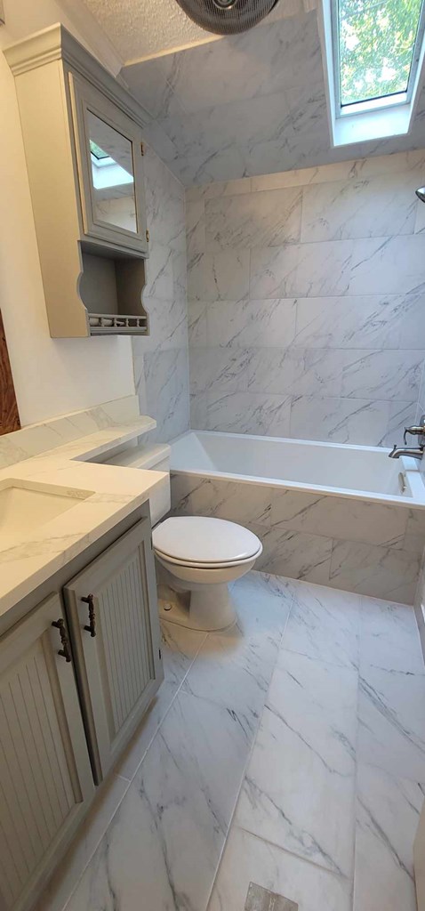 125 Sputnik Street Fortson, GA 31808 - Photo 12 of 30 a bathroom with a sink a toilet and a mirror