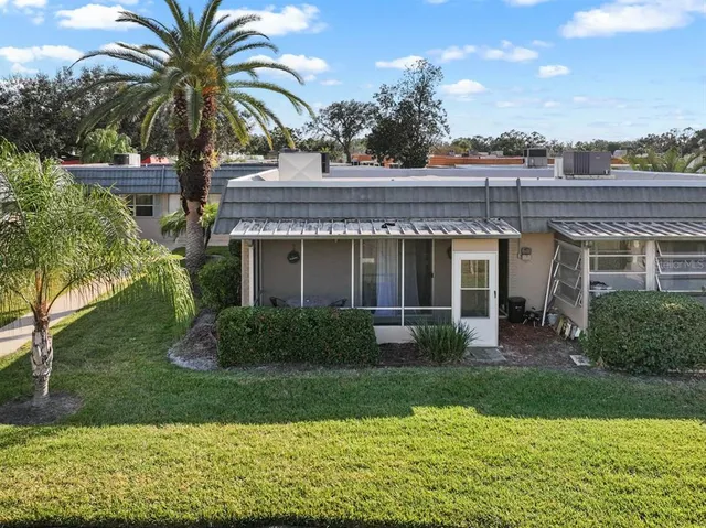 an aerial view of a house with outdoor space and street view