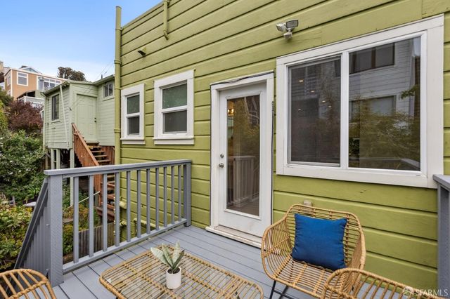 a view of a brick house with a large window