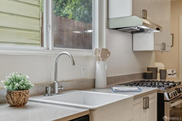 a kitchen with a stove and a sink