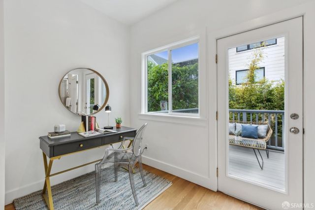 a room with a table chair and a window