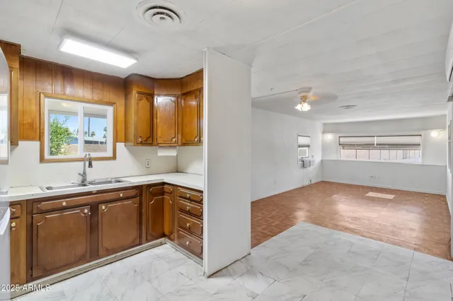 a kitchen with a sink and cabinets