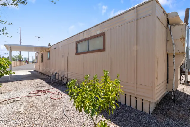 a view of a swimming pool with outdoor seating and a garden