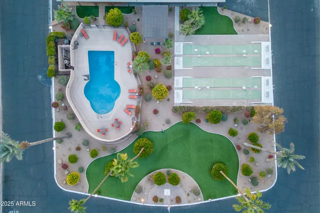 a view of a porch with furniture and a yard