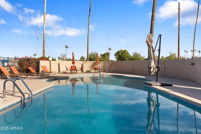 a building outdoor space with patio furniture and potted plants