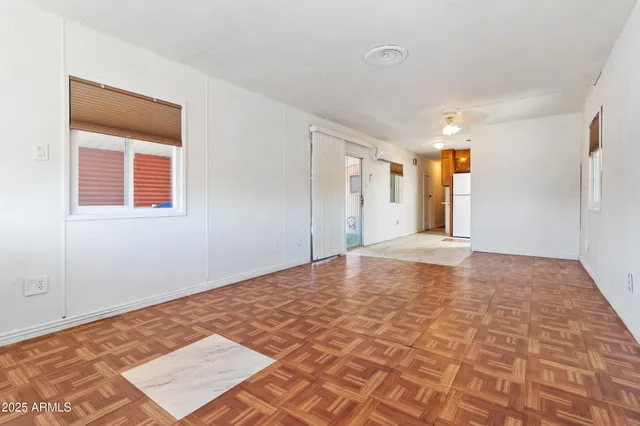 a view of a big room with windows