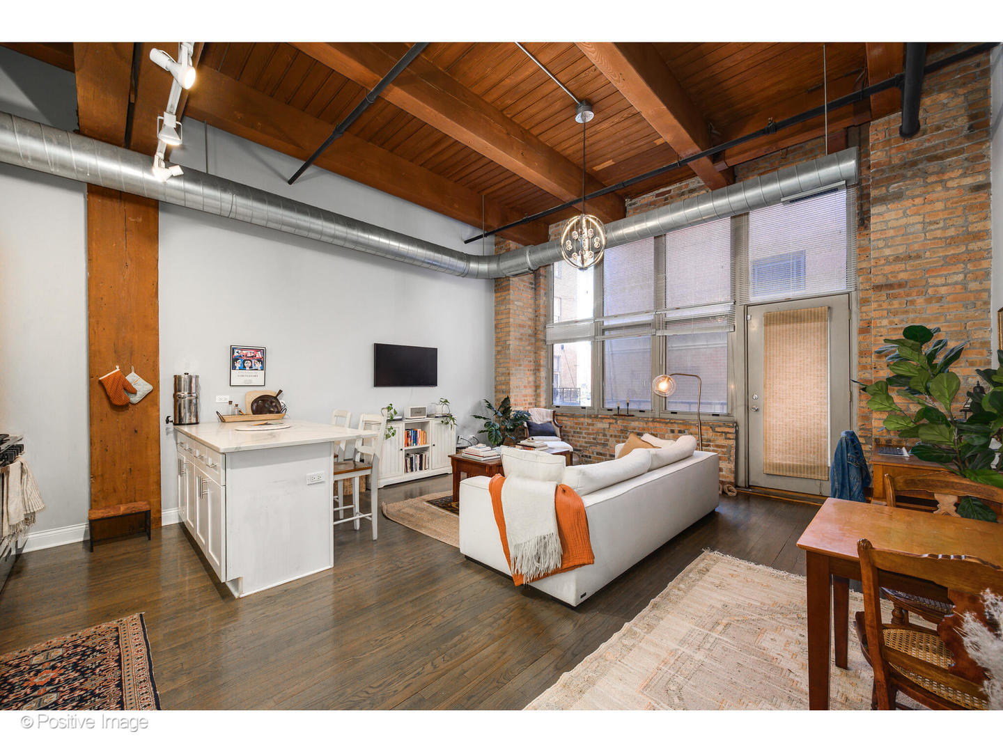 1500 West Monroe Street, Unit 215 Chicago, IL 60607 - Photo 4 of 14 a living room with furniture and a flat screen tv