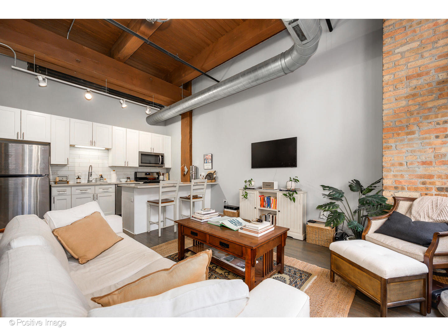 1500 West Monroe Street, Unit 215 Chicago, IL 60607 - Photo 7 of 14 a living room with furniture and a flat screen tv