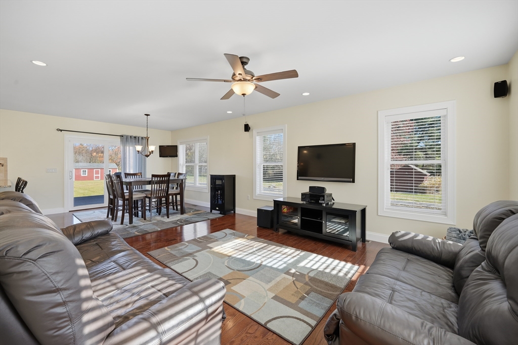 559 East State Street Granby, MA 01033 - Photo 11 of 41 a living room with furniture and a flat screen tv