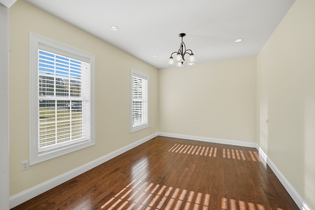 559 East State Street Granby, MA 01033 - Photo 14 of 41 a view of an empty room with wooden floor and a window