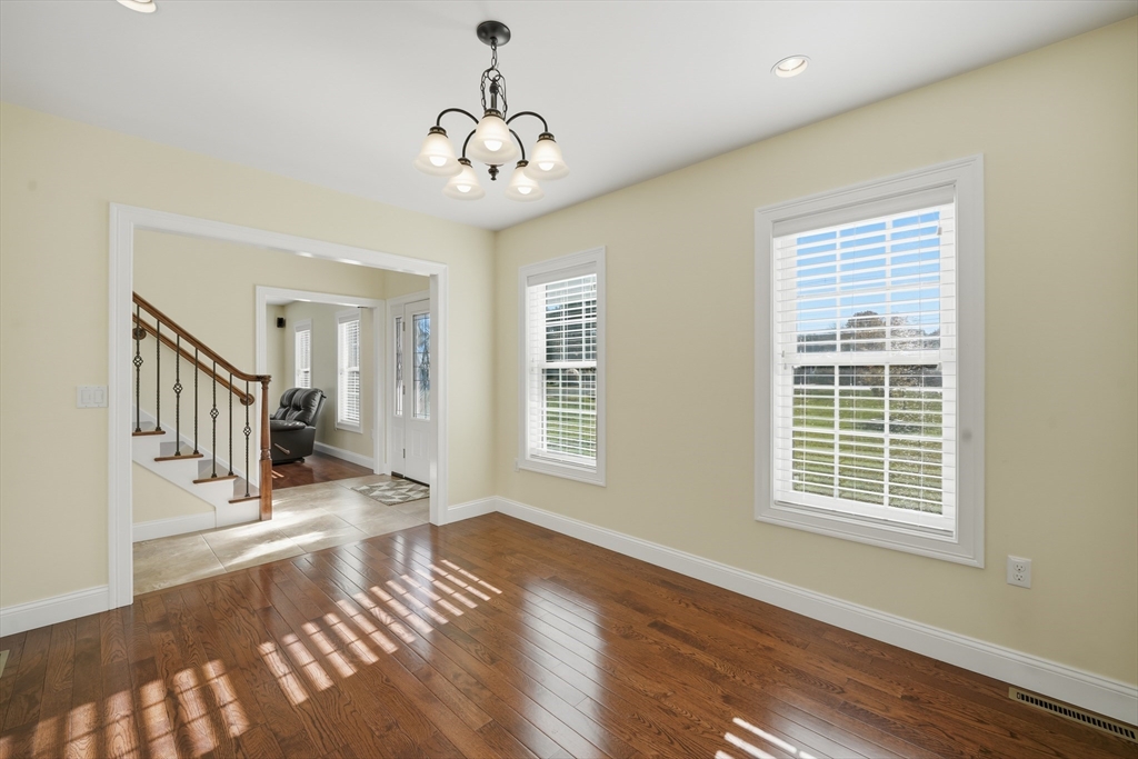 559 East State Street Granby, MA 01033 - Photo 16 of 41 a view of an empty room with wooden floor and a window