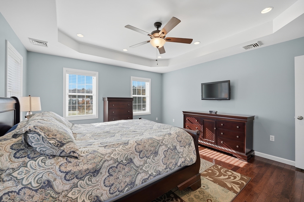 559 East State Street Granby, MA 01033 - Photo 20 of 41 a bedroom with a bed and a flat screen tv