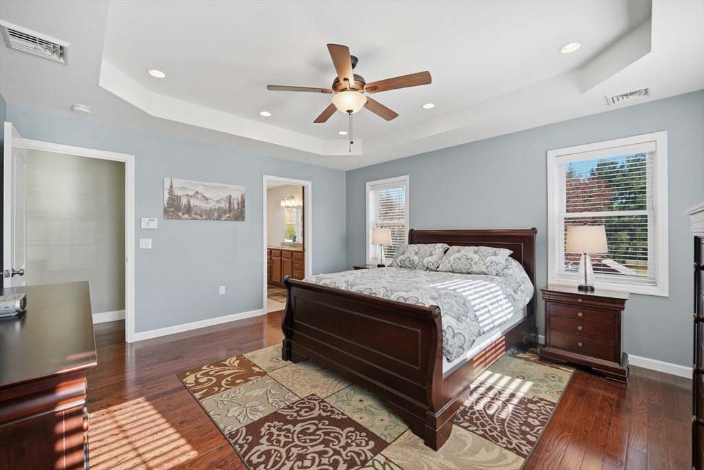 559 East State Street Granby, MA 01033 - Photo 21 of 41 a spacious bedroom with a bed and wooden floor