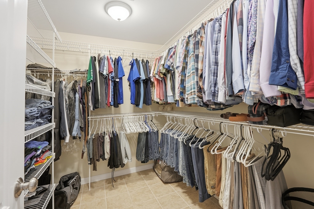 559 East State Street Granby, MA 01033 - Photo 24 of 41 a view of walk in closet with clothes and shoes