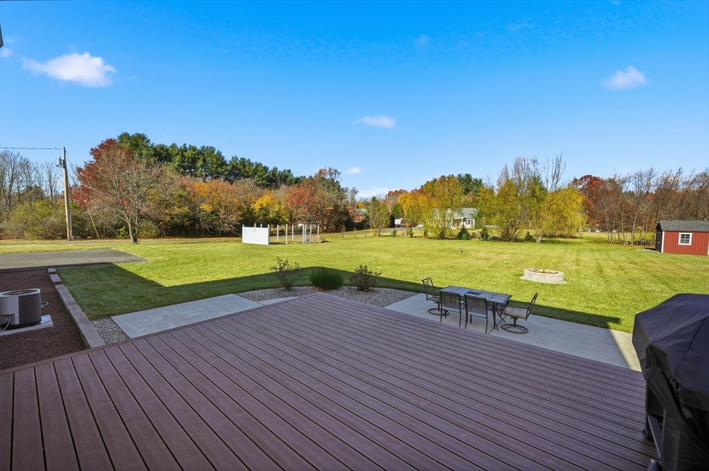 559 East State Street Granby, MA 01033 - Photo 33 of 41 a view of a lake with a yard and a wooden fence