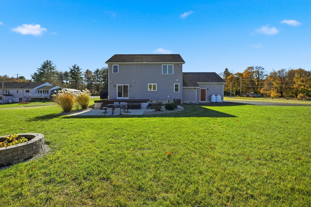 559 East State Street Granby, MA 01033 - Photo 36 of 41 a front view of a house with garden