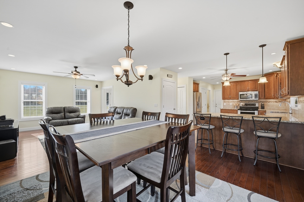 559 East State Street Granby, MA 01033 - Photo 7 of 41 a dining room with furniture a chandelier and wooden floor