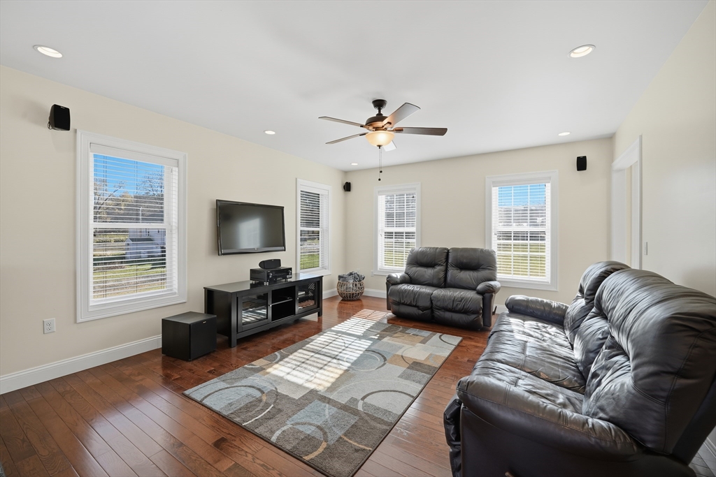 559 East State Street Granby, MA 01033 - Photo 9 of 41 a living room with furniture and a flat screen tv